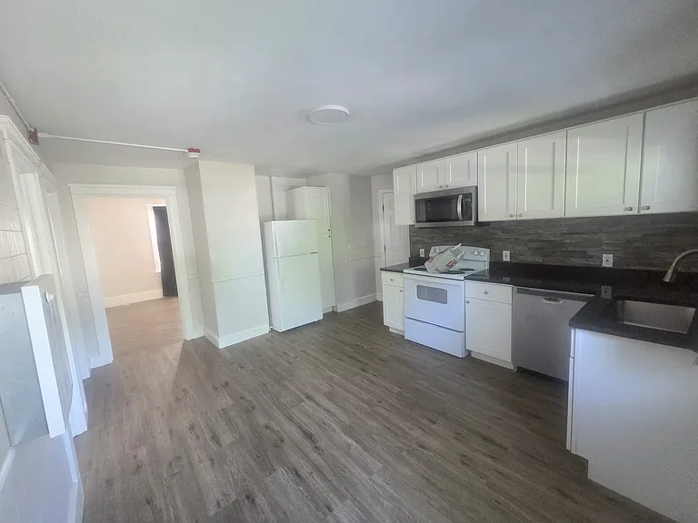 Kitchen From Rear Entrance View to Living Room