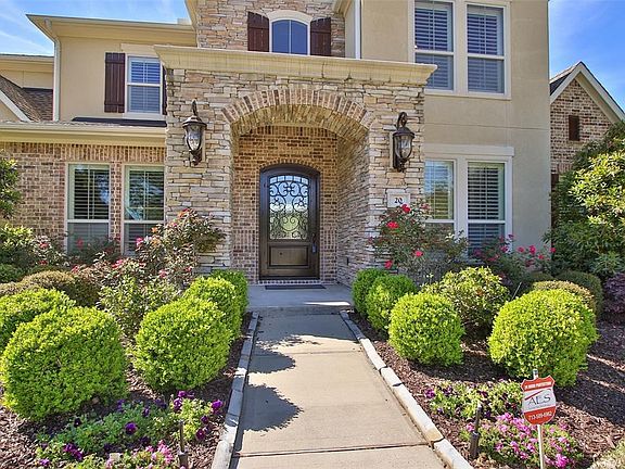 Professionally Landscaped For Great Curb Appeal With Elevation That Has Stone, Brick, & Stucco.
