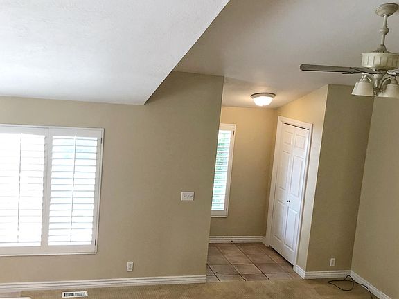 Entry Into Living Room/Kitchen w/ High Vaulted Ceilings & Ga