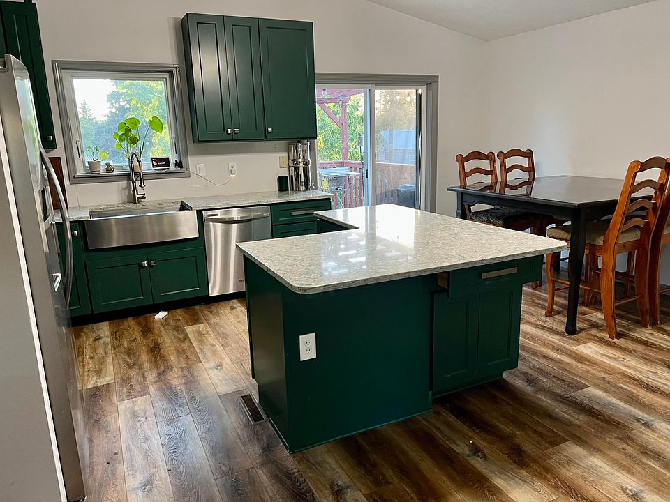 Enjoy the Chefs Kitchen with custom cabinets and stone countertops