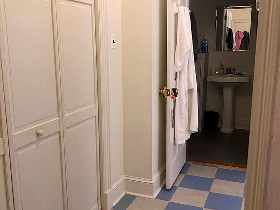 Entry hall to apartment and bathroom.
