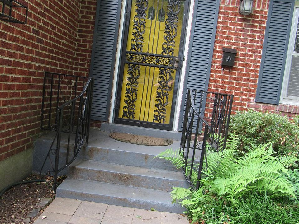 Sunny yellow door welcomes you home. Oops, we repainted it grey! Much, much better