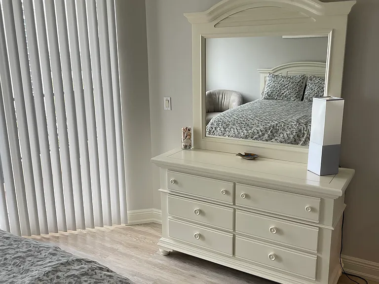 There is ample storage in the guest bedroom which has a walk in closet and ceiling fan