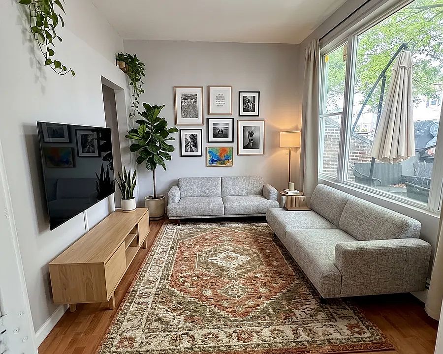 Living- This room has been virtually staged using AI to help visualize its layout and design potential.