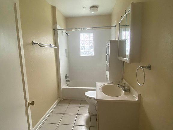 upstairs bathroom. Newly tiled tub surround