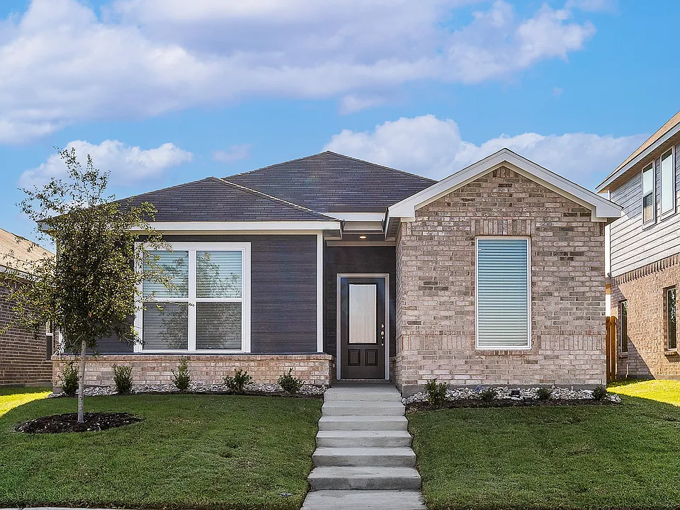 The Orchid is a beautiful one-story home with a siding exterior and brick accents.