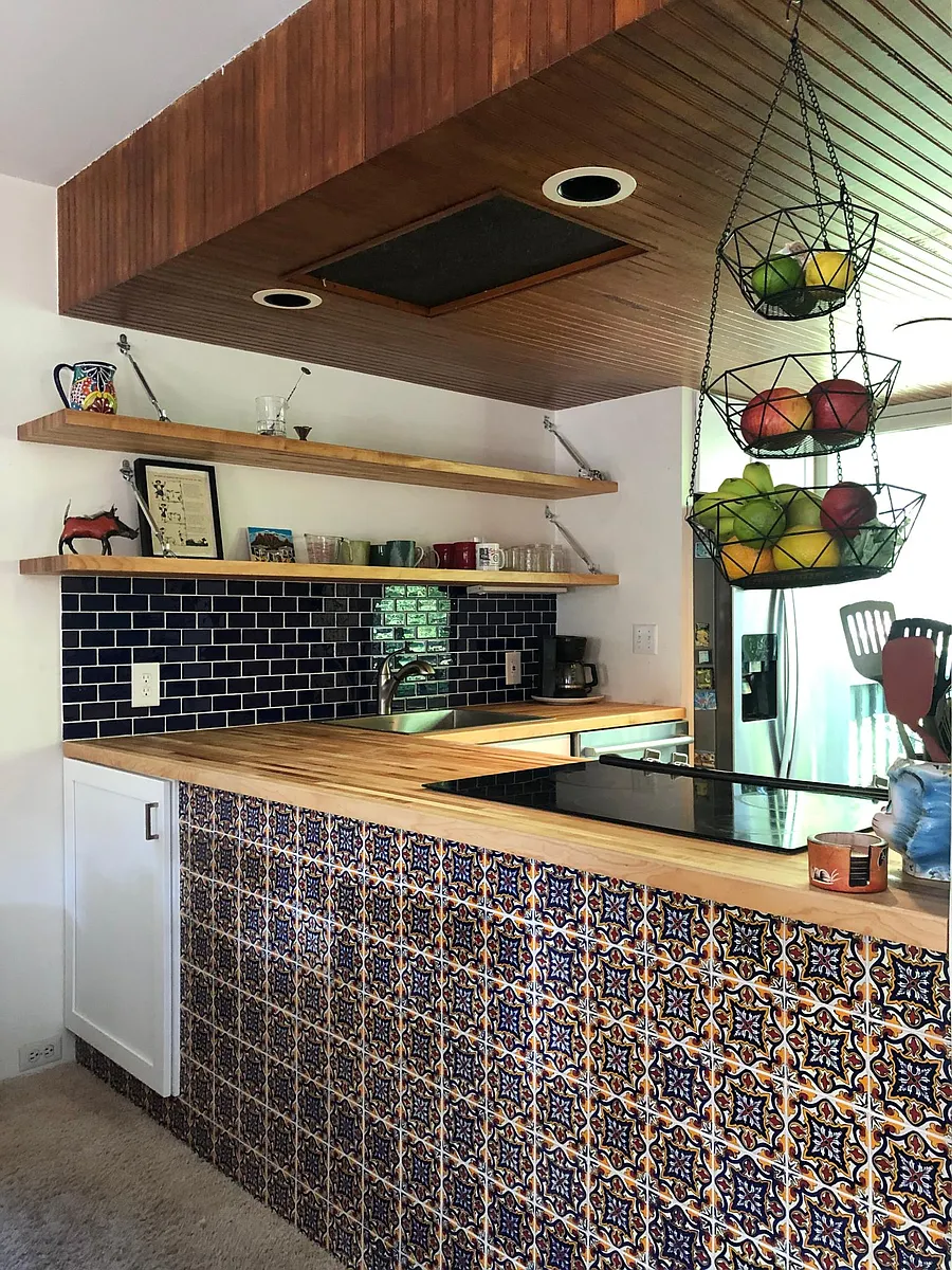 Unique kitchen features hand-painted Talavera tiles. Great for entertaining because slide-in stove faces out to the dining and living areas. - 120 Arundel St