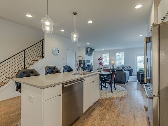 open floor plan, kitchen, dining room, living room, leading to covered outdoor patio.