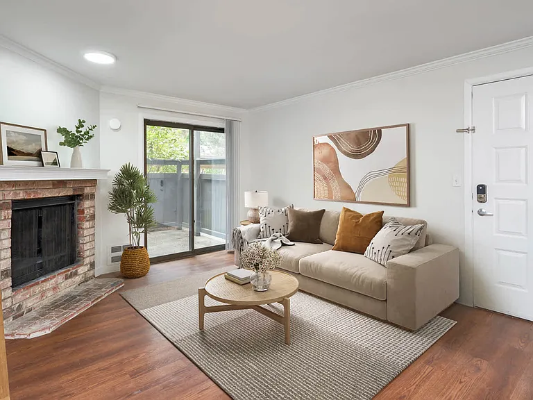 Living Room with Fireplace and Balcony