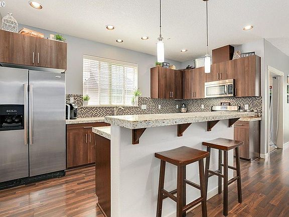 Kitchen with counter and stainless steel appliances