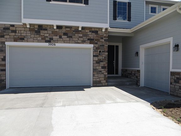 Two car garage door, home entrance main door and a single car garage door