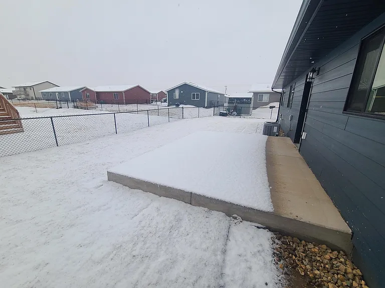 back yard and patio. Fenced and sprinkler system with fresh sod
