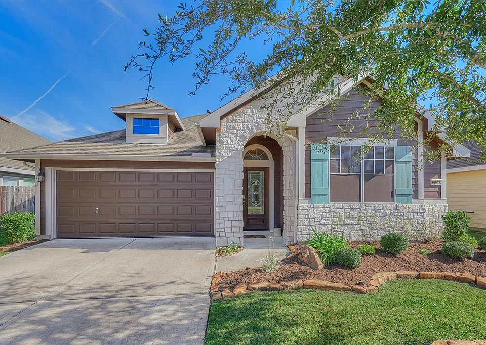 Welcome home to 30938 Blue Ridge Park Lane, nestled within the beautiful Imperial Oaks Park neighborhood of Imperial Oaks.