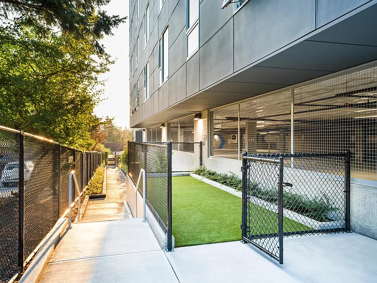 Let your pup play and socialize at Modera Shoreline's fenced dog run, a convenient on-site space designed for daily adventures and fresh air.