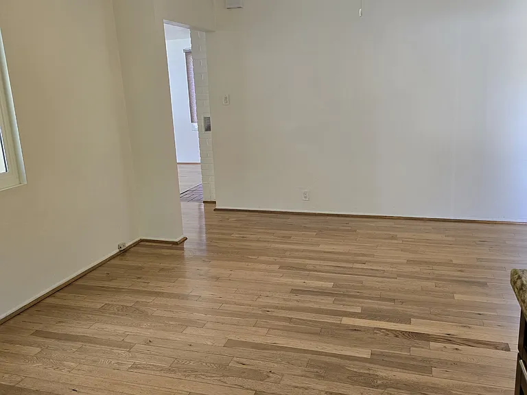 From kitchen stove over looking the dining room into the living room