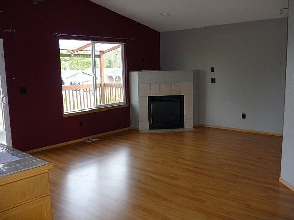 Warm Designer Colors & Cozy Fireplace in Living Room