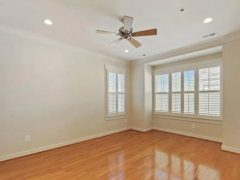 Primary Bedroom with Hardwood Fllors and Ceiling Fan