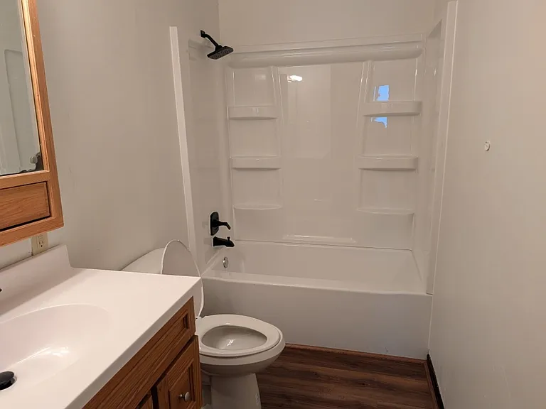 Full bathroom with tub/shower combo and updated black fixtures