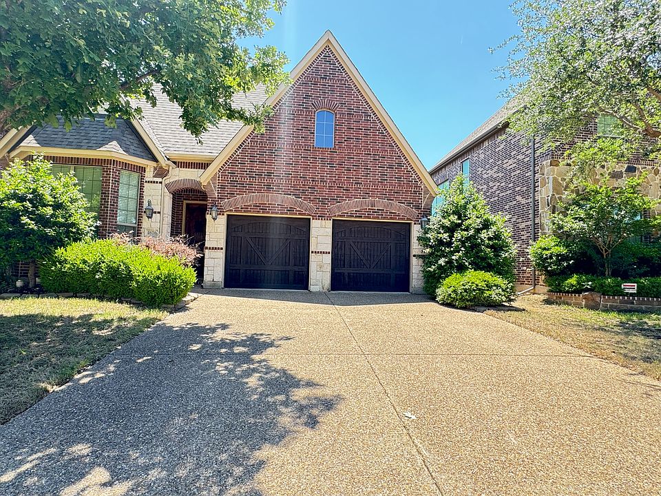 Front of the property showing the driveway and garage
