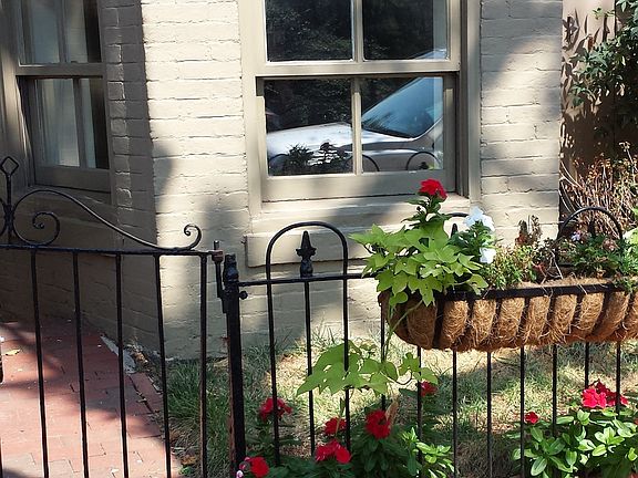 a traditional D.C. English basement/ entrance is the left