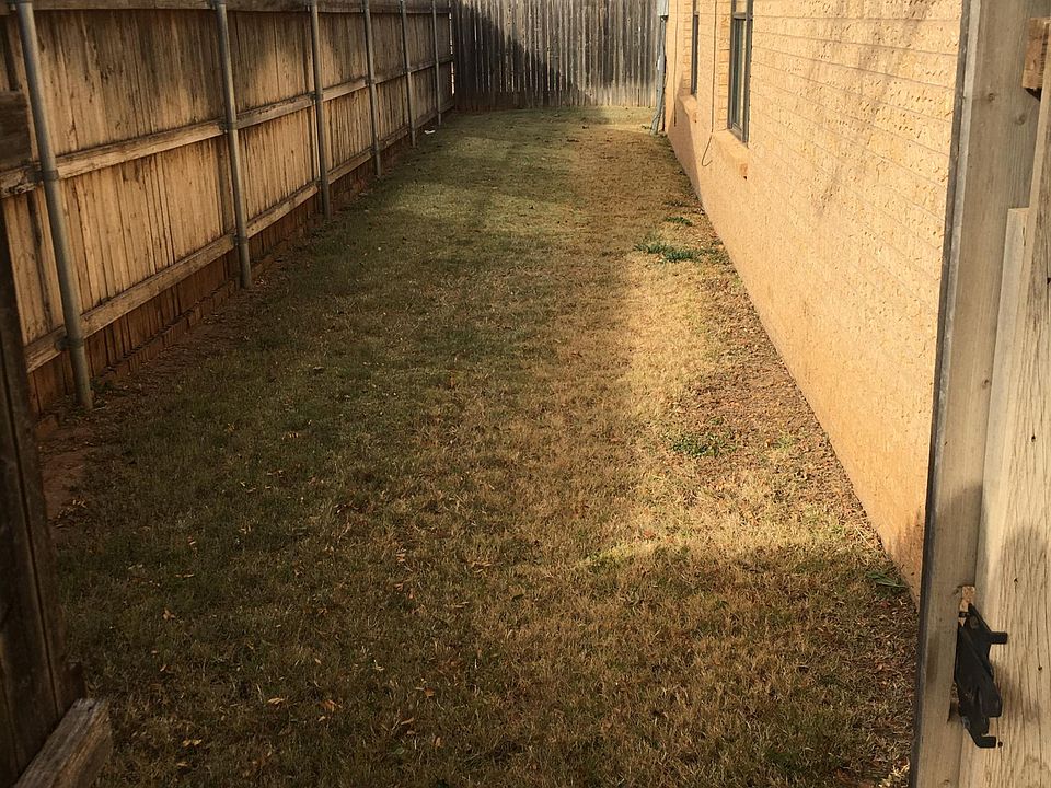 GRASSED SIDE AND BACKYARD YARDS RECEIVE 4 CHEMICAL TREATMENTS PER YEAR. SPRINKLER SYSTEMS.