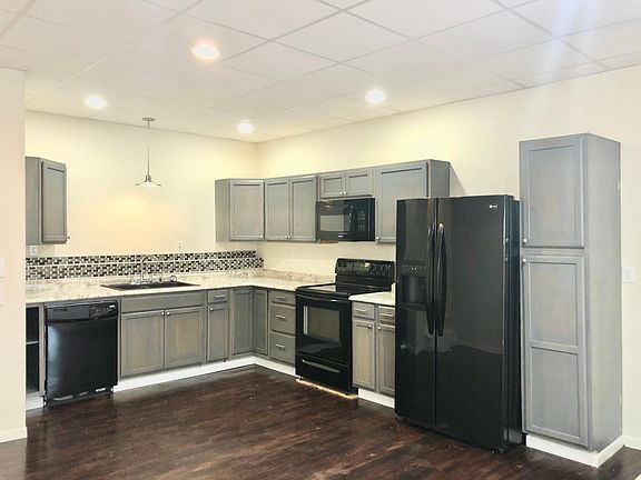 Lots of cabinets and nice appliances.