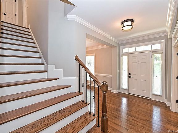 Beautiful hardwoods and wrought iron railing