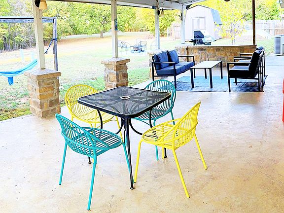 Back porch with seating and dining area