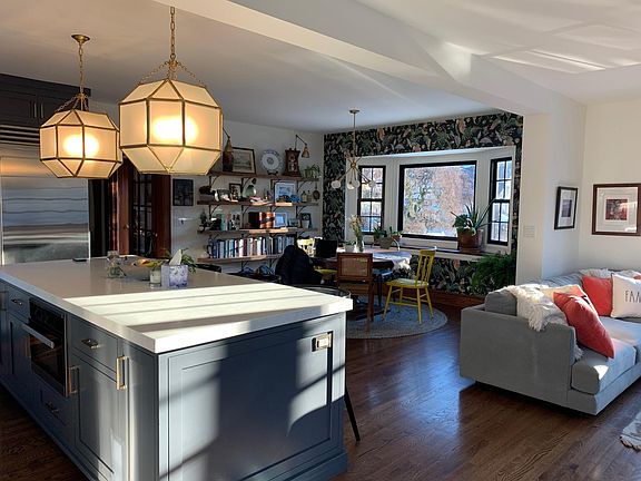 Open plan kitchen, dining and family room receives abundant natural light.
