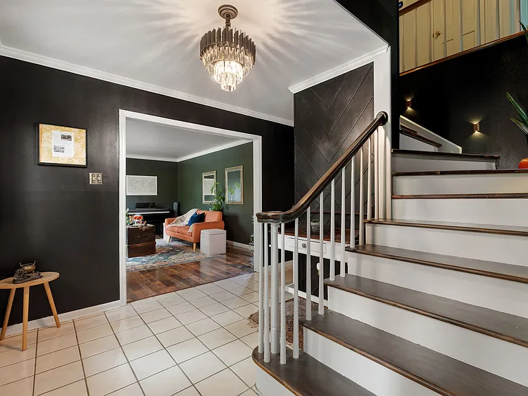 Front entryway with a glimpse of sitting room