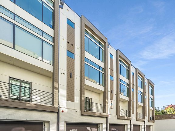 back of townhome and garage door