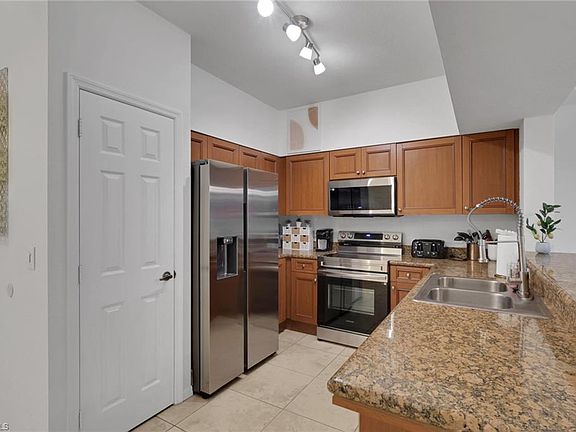 5th image of 10121 Villagio Palms WAY #102