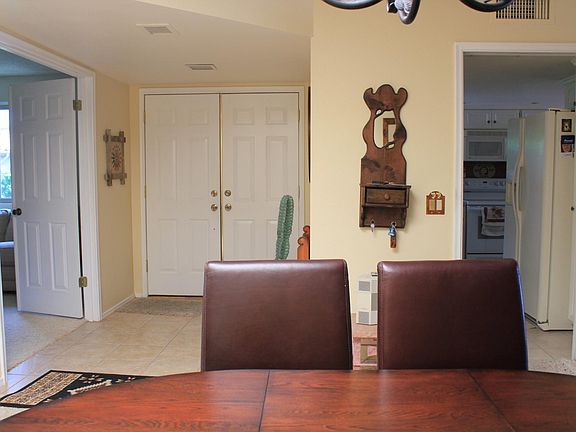 Main Doorway middle, left is door to office/bed 3, door to right is into kitchen