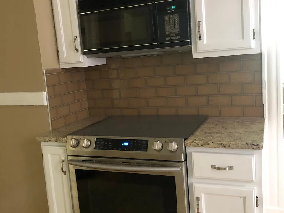 Stainless steel appliances in kitchen.