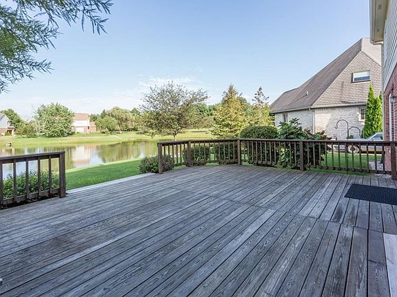 Huge wood deck that overlooks pond area
