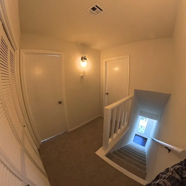Upstairs hallway with laundry