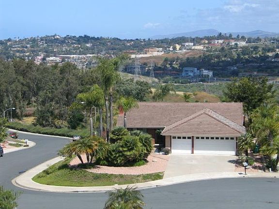 Elevated front shows mountain view to rear