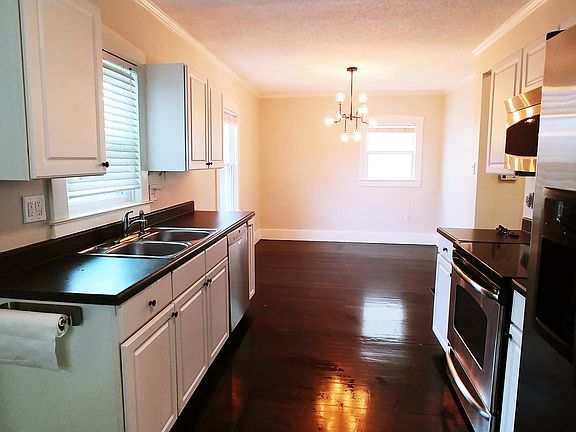 Large eat- in kitchen is well equipped with stainless appliances. Dishwasher, stove, microwave, refrigerator and garbage disposal in the double stainless sink. Great cabinets and layout is great for cooking!