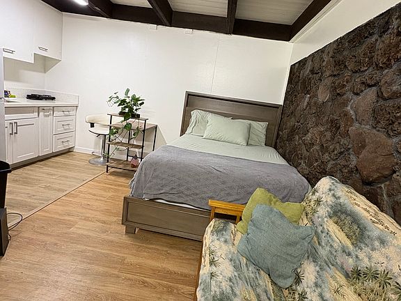 With furniture, includes queen size bed and futon chair