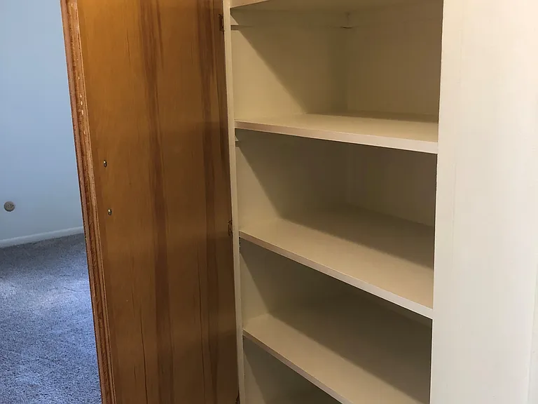 Linen cabinet between the bedrooms.