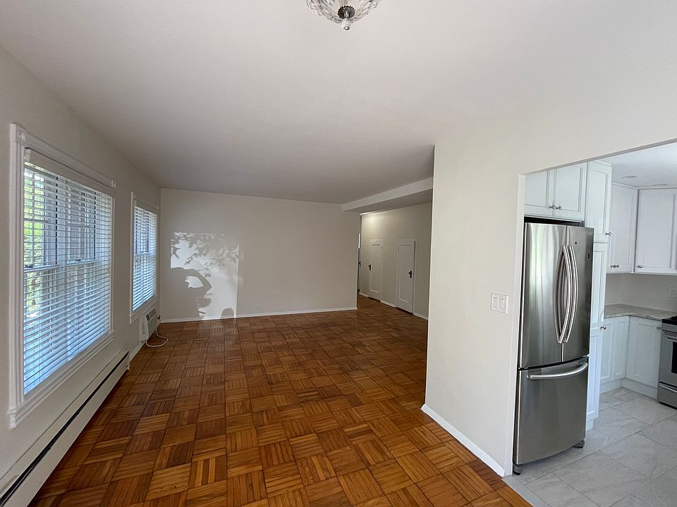 Entryway opens to living room and kitchen
