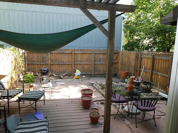 private fenced backyard with trex deck and pergola