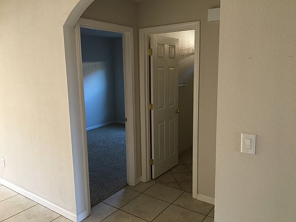 Hallway between bed and bath