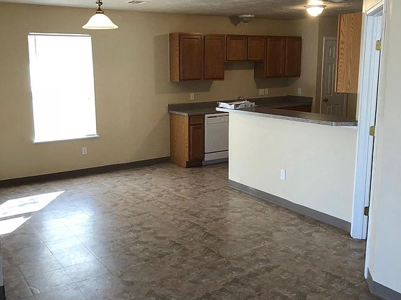 In-kitchen dining opens to living room.