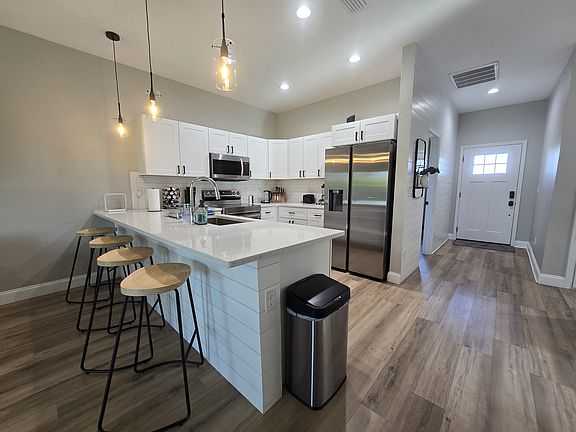 Eat-in kitchen with bar seating for 4 Both are currently rented. (not furnished)