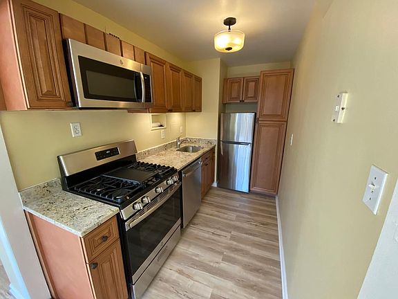 New, full size, stainless steel appliances: stove, fridge, microwave and dishwasher