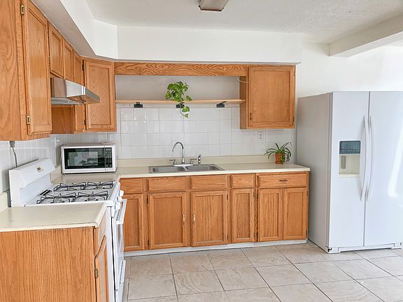 Updated kitchen with ample cabinet space and modern layout.