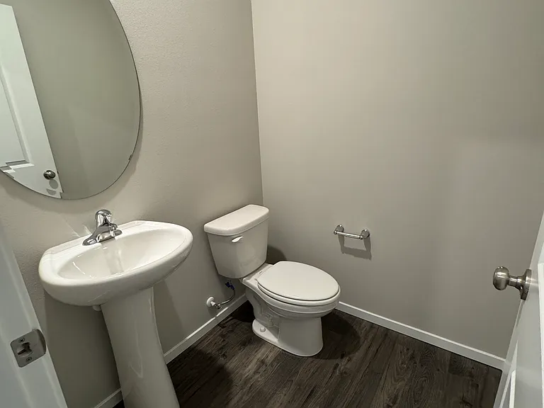 1st floor half bath. Located in entry hall near kitchen and living room.