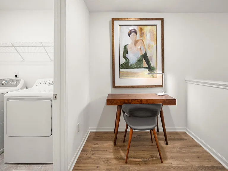 Full-size washer and dryer included, with a versatile loft ideal for a home office.