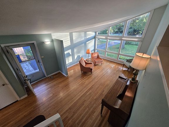 View from the top of the staircase down to the living room.